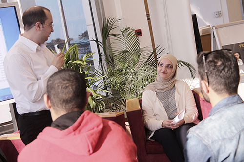 Auk library holds a poetry reading and book signing for yousef nayef