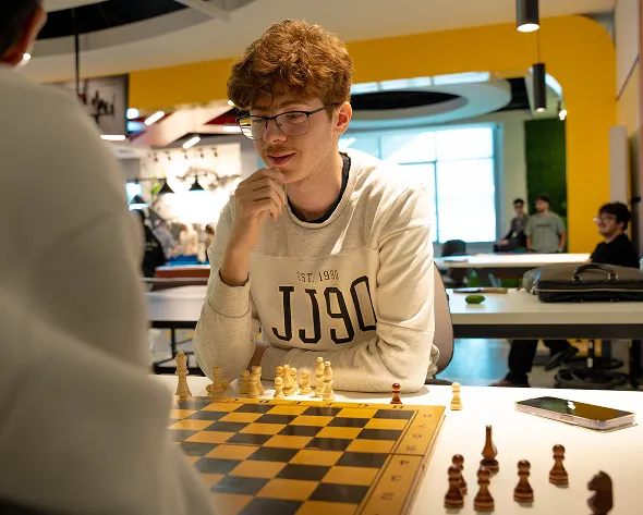 Students have the opportunity to relax and enjoy themselves by playing chess.