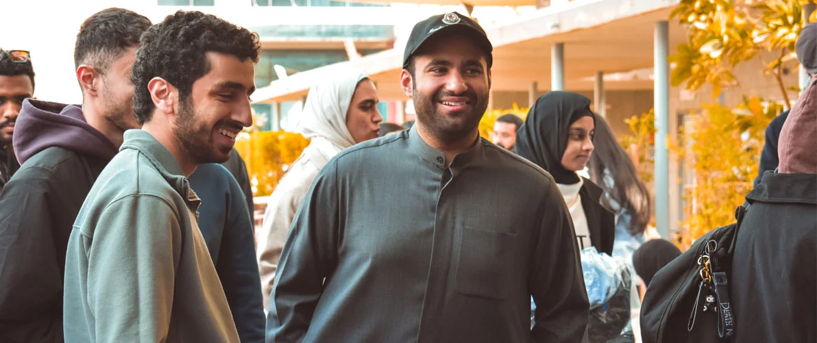 AUK students celebrating their scholarships and financial aid, empowering their education journey