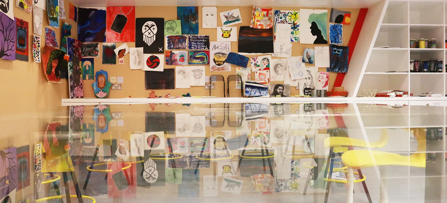 A stunning collection of paintings created by AUK students, proudly displayed in an inspiring art exhibition.