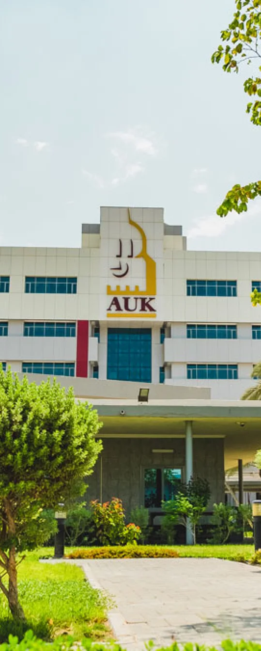 The AUK university building with a prominent nameboard, proudly displaying its esteemed identity.
