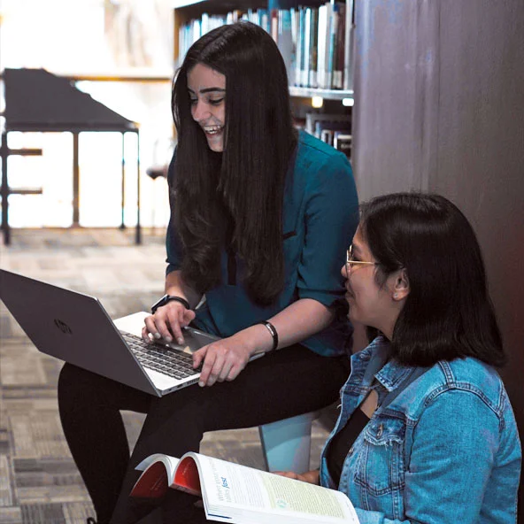 Students at an AUK learning center engaged in a thought-provoking discussion.