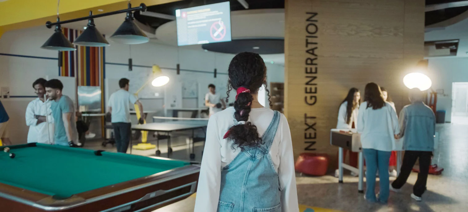 AUK students playing and enjoying their time in the indoor sports lounge.